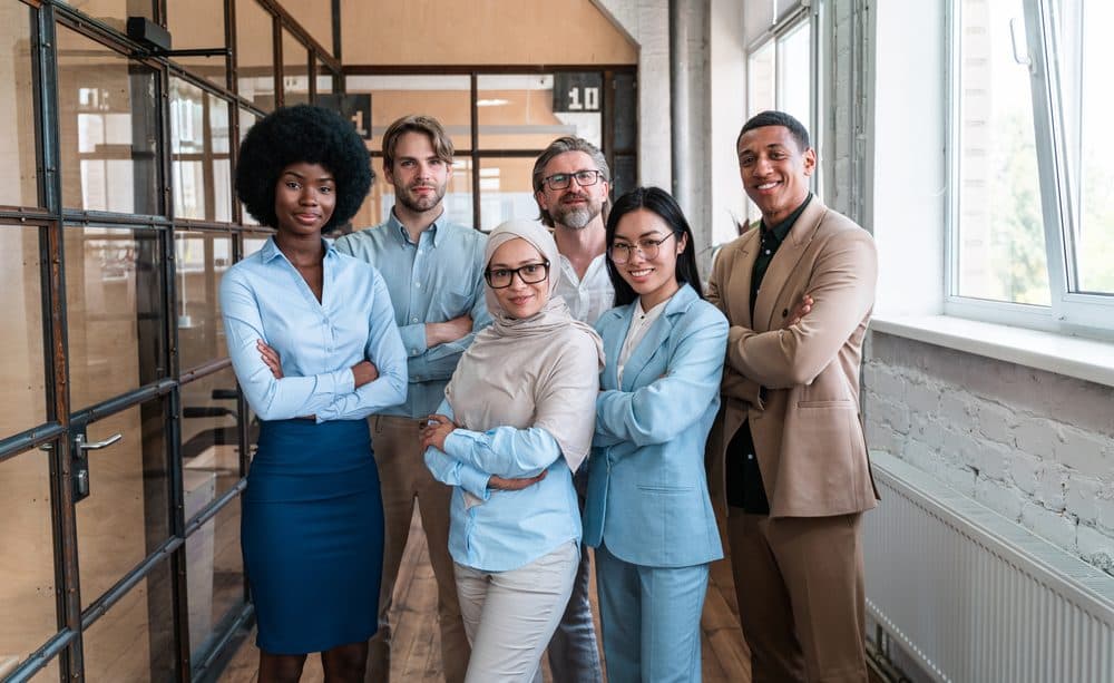 Supply chain professionals standing together in an office