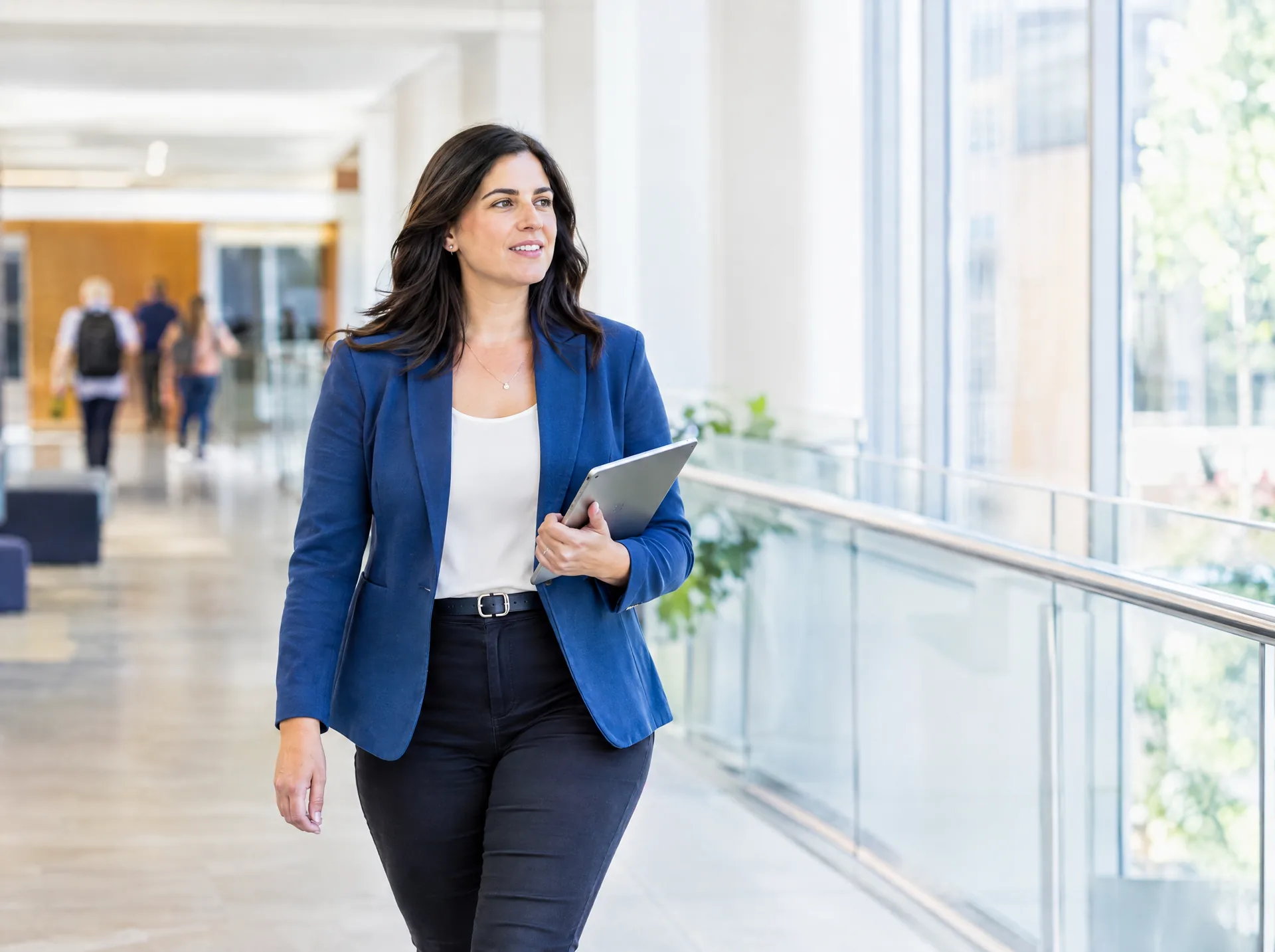 University administrator walking through a campus building