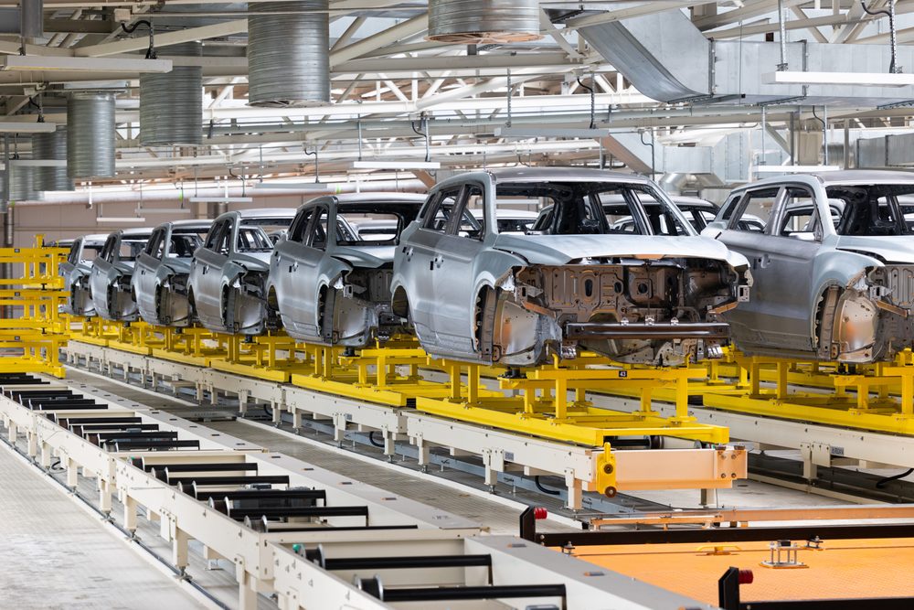 Vehicle bodies moving along an automotive assembly line